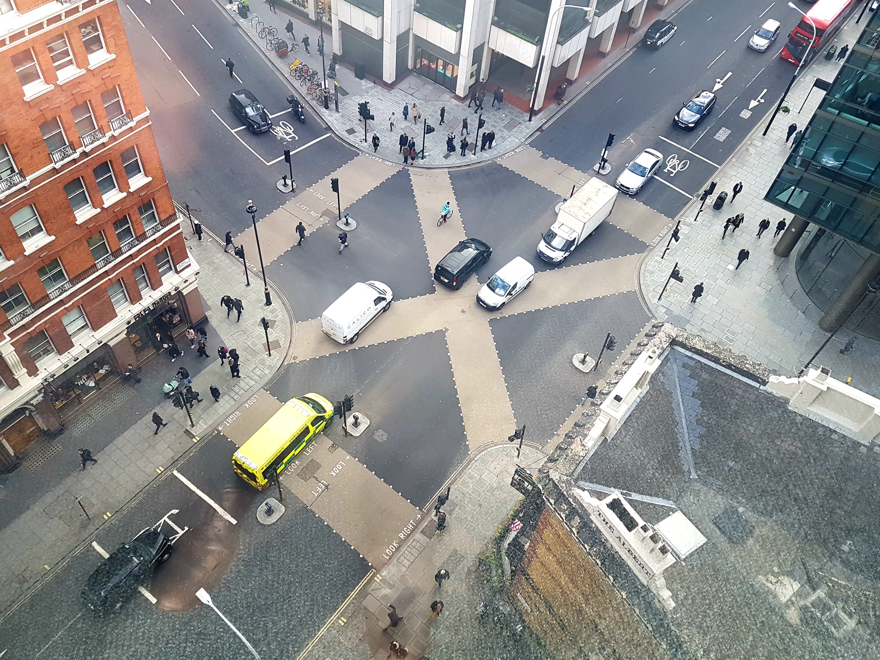 an X-shaped pedestrian crossing viewed from the tenth floor of a nearby building