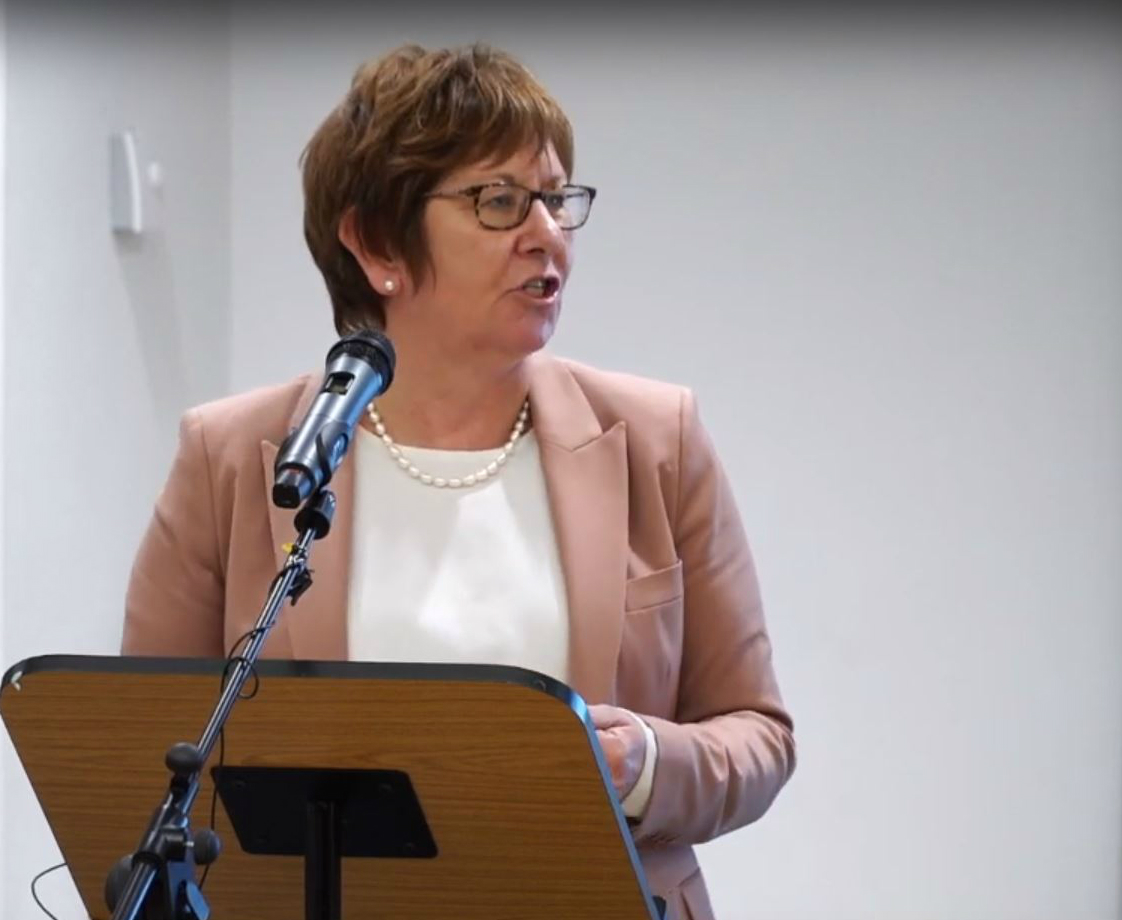 Permanent Secretary Bernadette Kelly speaking at a lectern